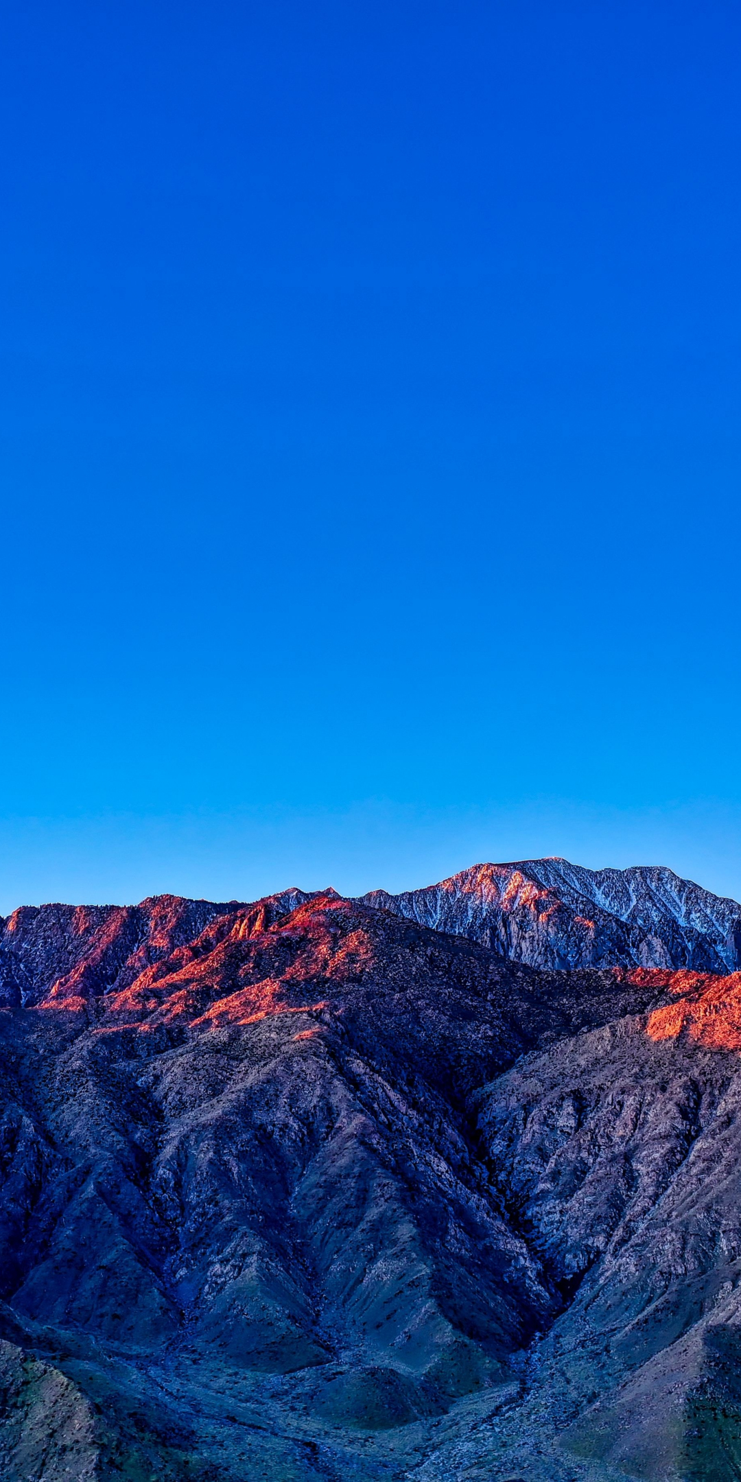 Blue sky, mountains, glowing summits, sunset, 1080x2160 wallpaper