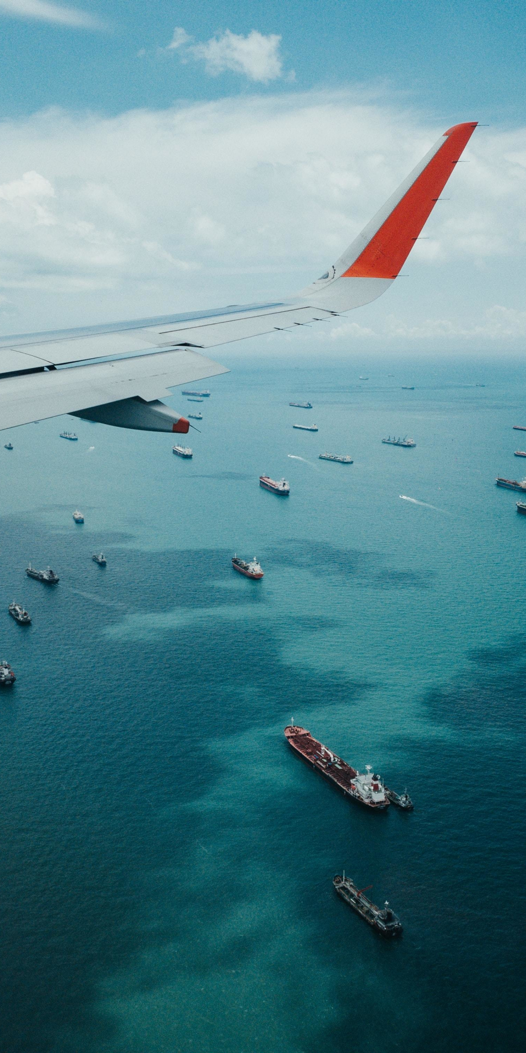 Airplane wing, boat, sea, aerial view, 1080x2160 wallpaper