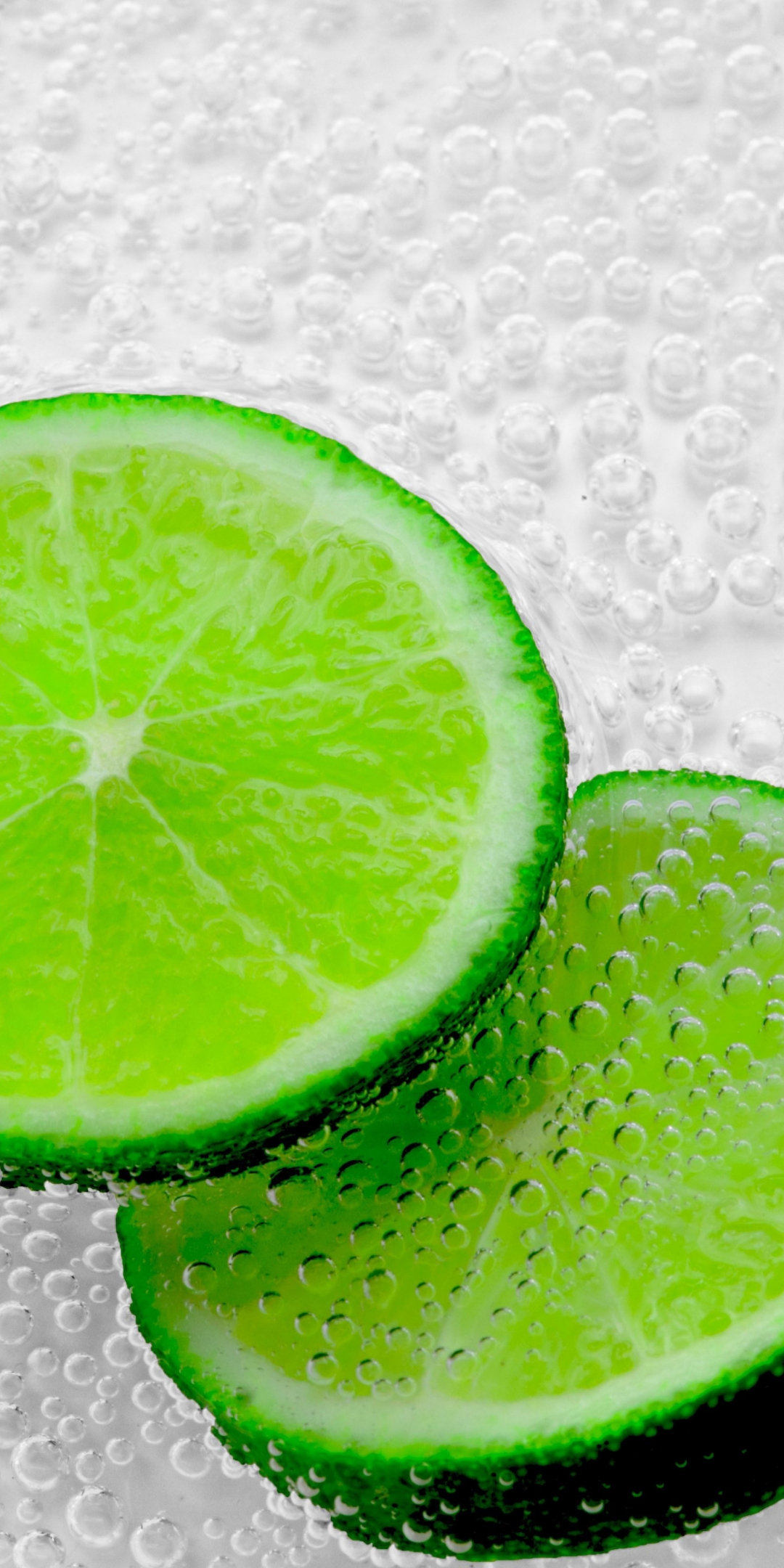 Green lemon slices, bubbles, close up, 1080x2160 wallpaper