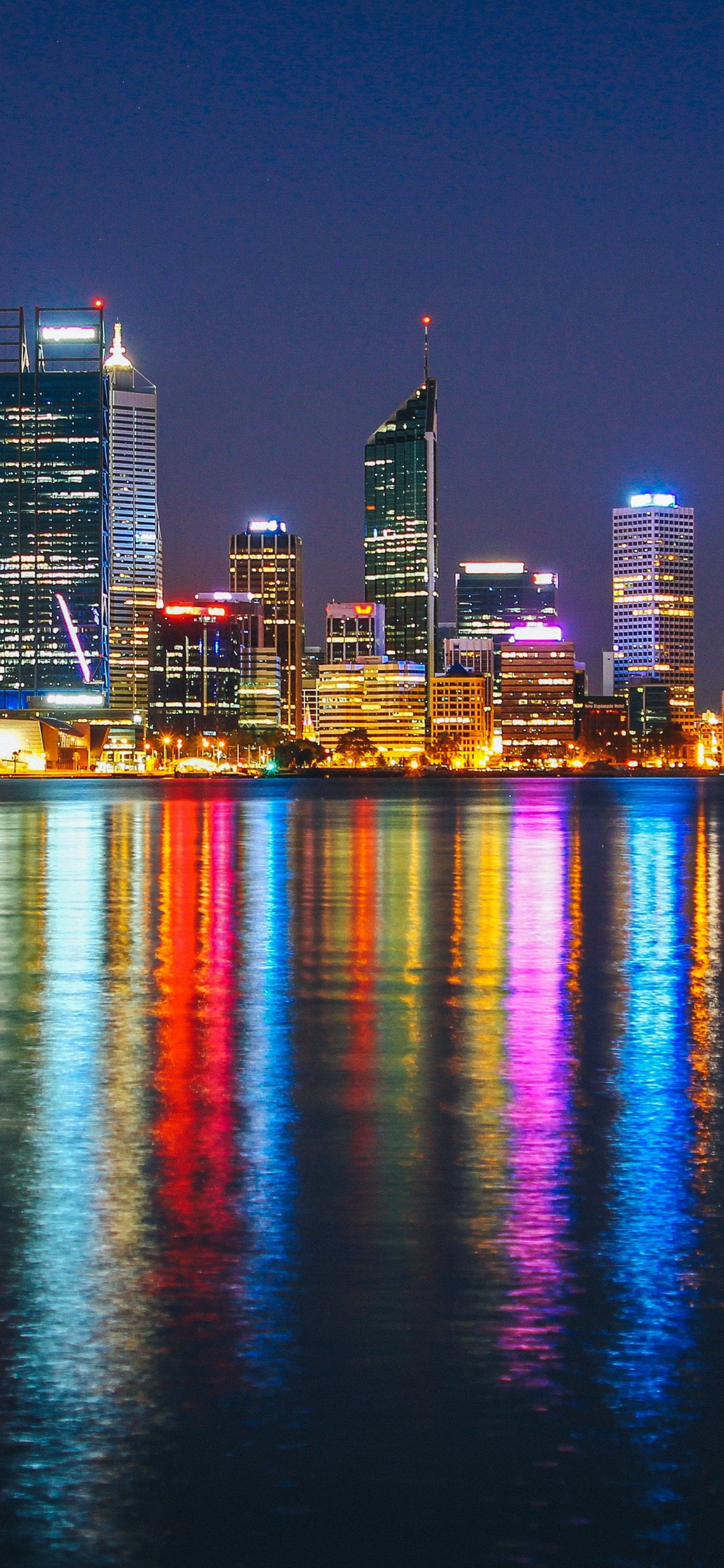 Download cityscape, buildings, colorful, reflections, night 1125x2436