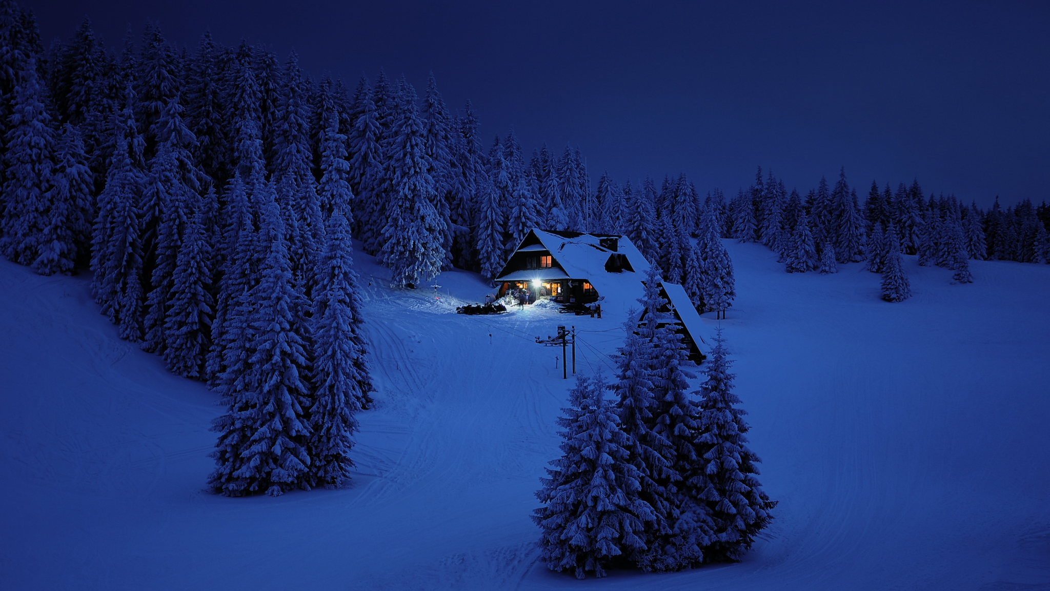 Download wallpaper 2048x1152 house, night, winter, trees, snow layer