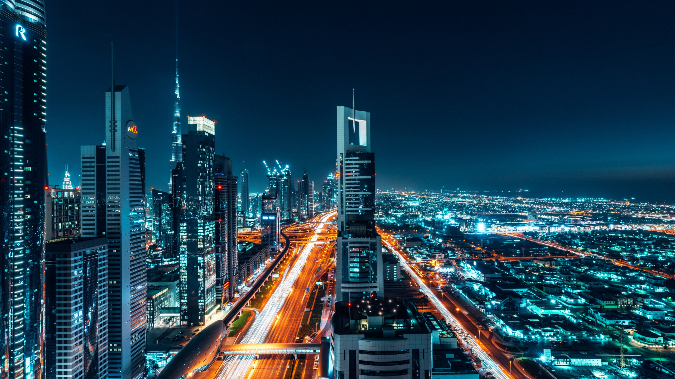 Download 2560x1440 wallpaper dubai, city, buildings, cityscape, night