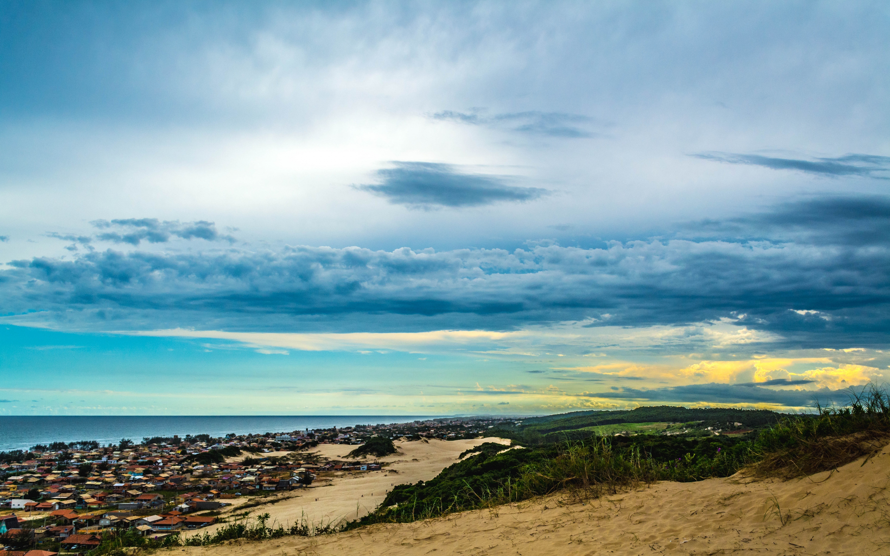 Sand, landscape, coast, city, clouds, sky, 2880x1800 wallpaper