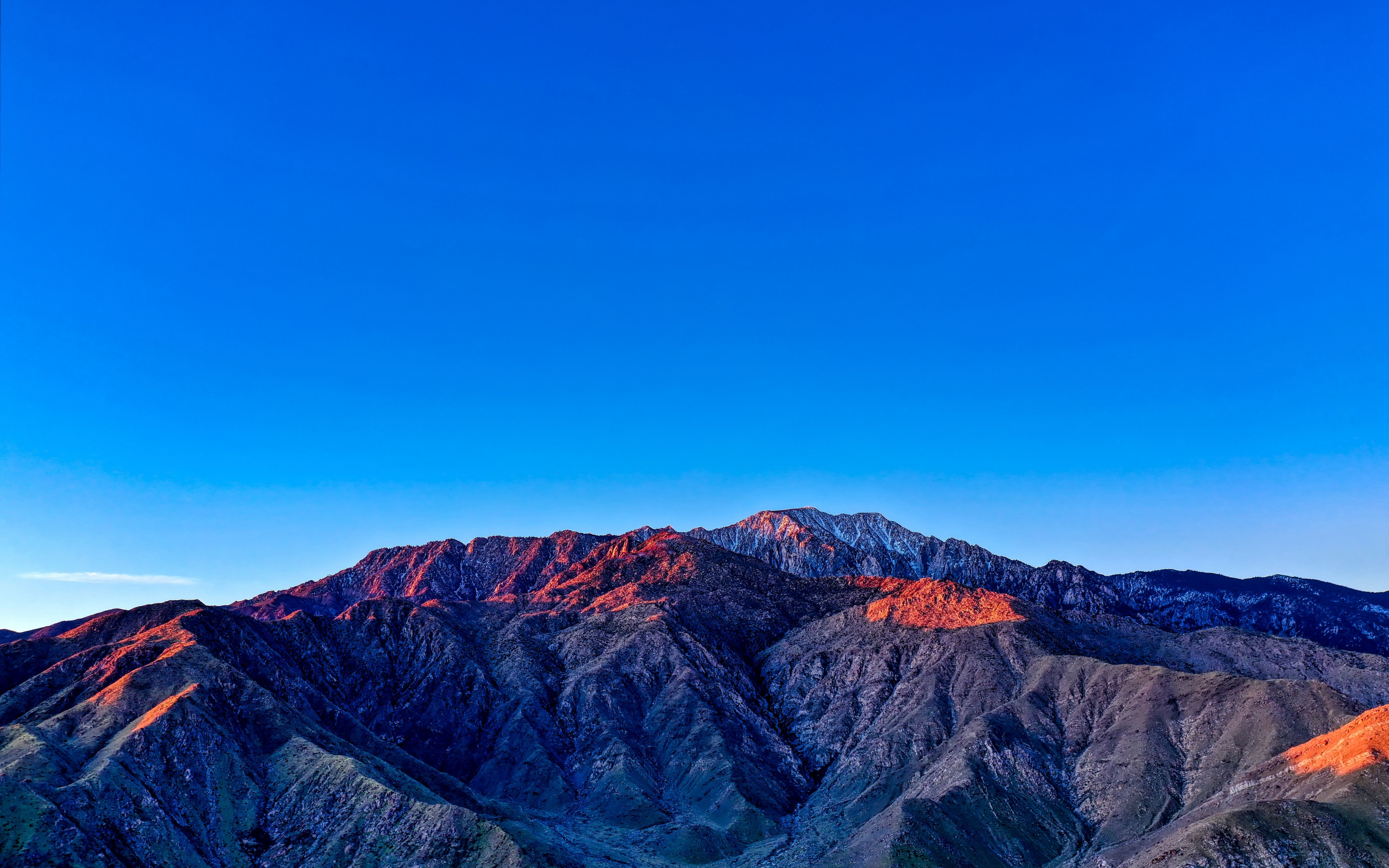 Blue sky, mountains, glowing summits, sunset, 2880x1800 wallpaper