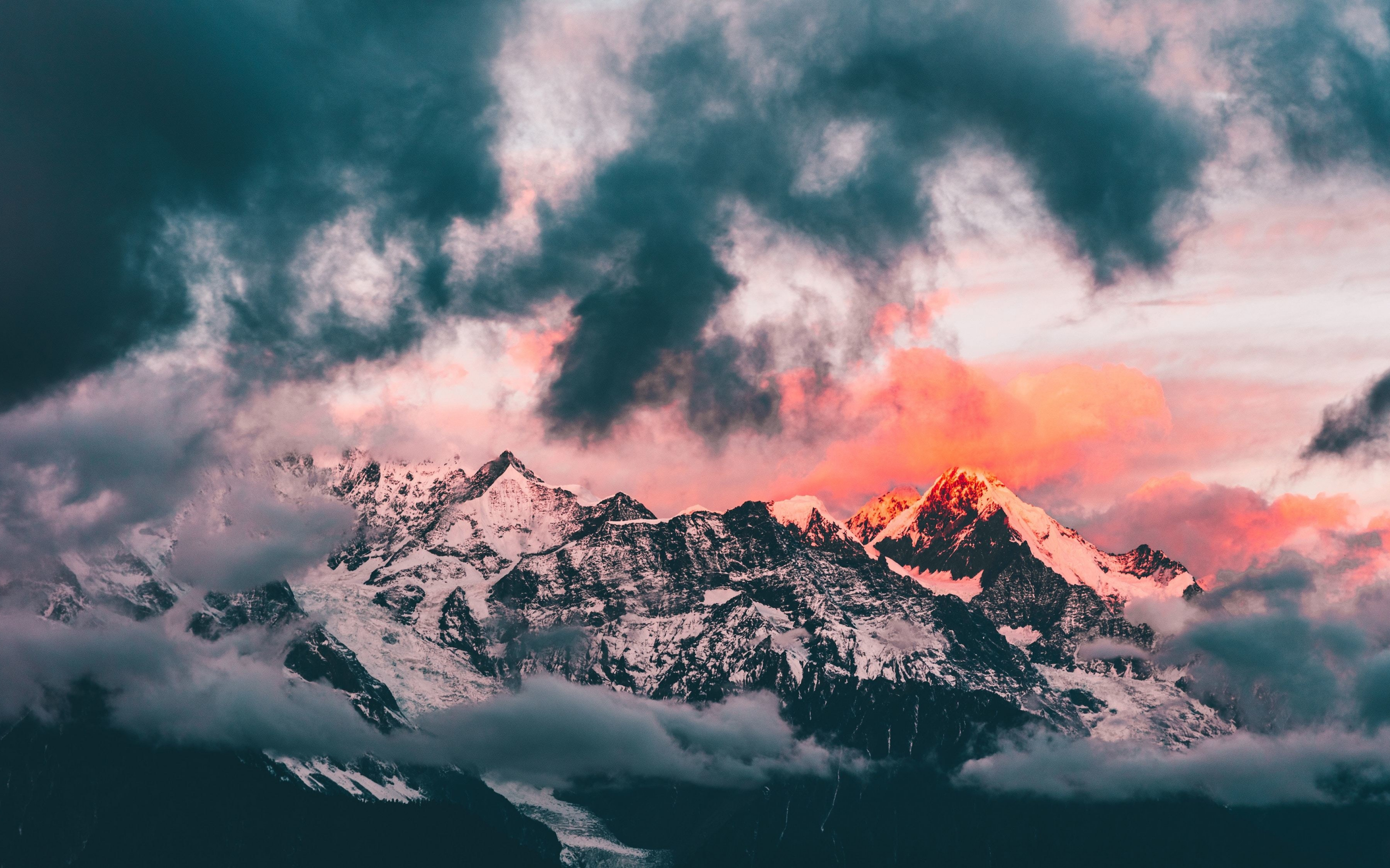 Clouds, sunset, glowing peaks, mountains, 2880x1800 wallpaper