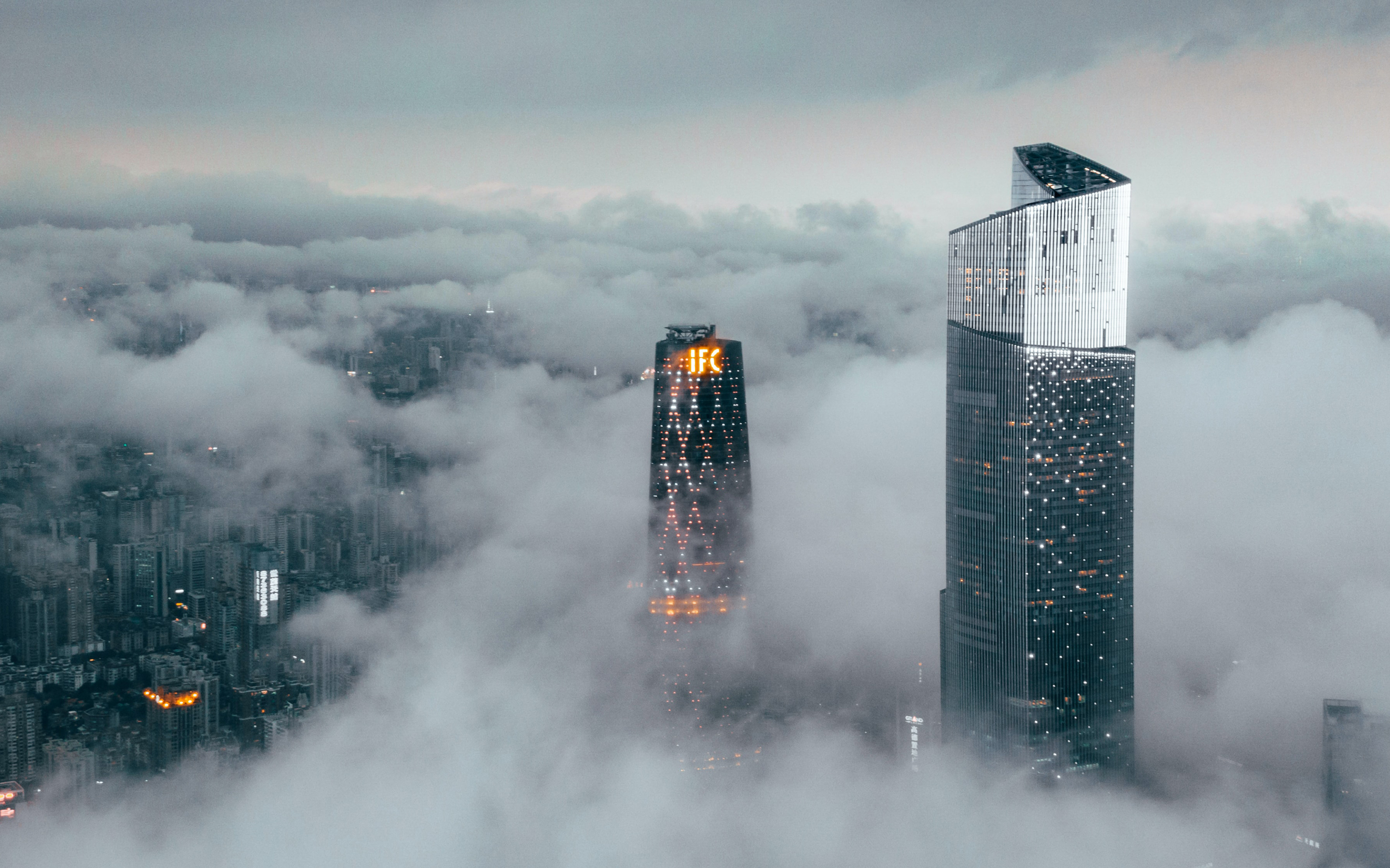 Clouds cover buildings, city, 2880x1800 wallpaper