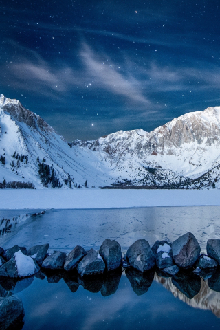 Snowy mountains, starry night, lake, rocks, 240x320 wallpaper