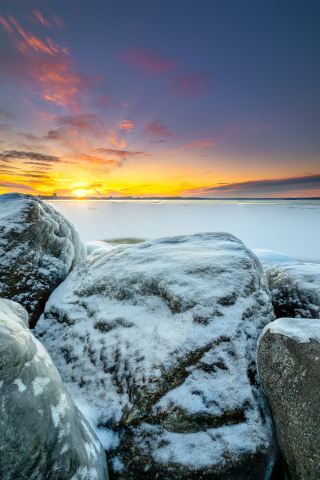 Snow layer, rocks, winter, frozen shore, sunset, 240x320 wallpaper