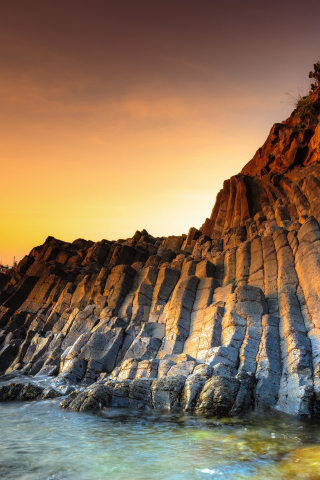 Coast, rocks of coast, sunset, 240x320 wallpaper