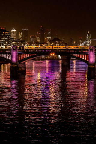 City, night at bridge, colorful glow on water, 240x320 wallpaper