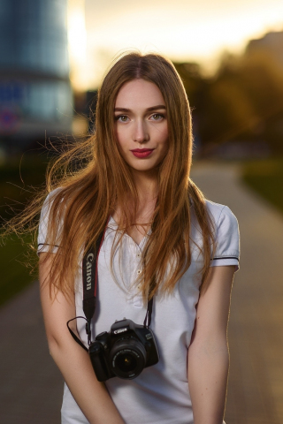 Woman with camera, blonde, outdoor, 240x320 wallpaper