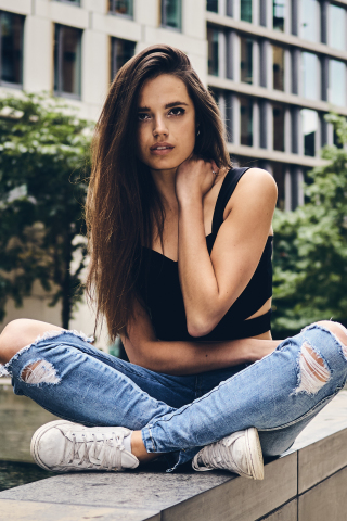 Brunette, girl model, teared jeans, sit, 240x320 wallpaper