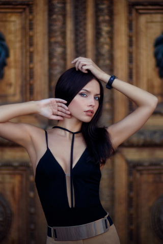 Girl model, black dress, arms up, 240x320 wallpaper