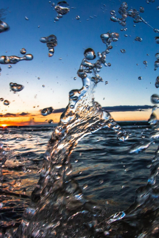 Water splashes, sea, sunset, close up, 240x320 wallpaper