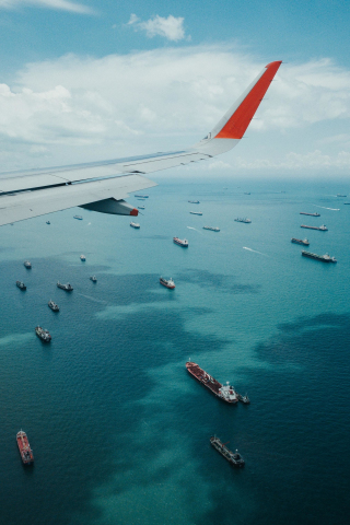 Airplane wing, boat, sea, aerial view, 240x320 wallpaper