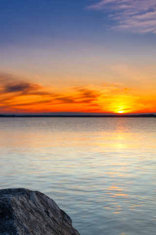 Sunset, seascape, rocks, yellow sky, 240x320 wallpaper