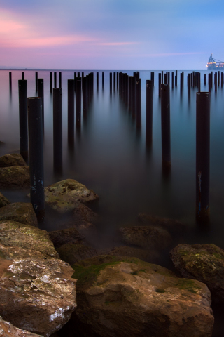 Seascape, sunset, wooden poles, 240x320 wallpaper