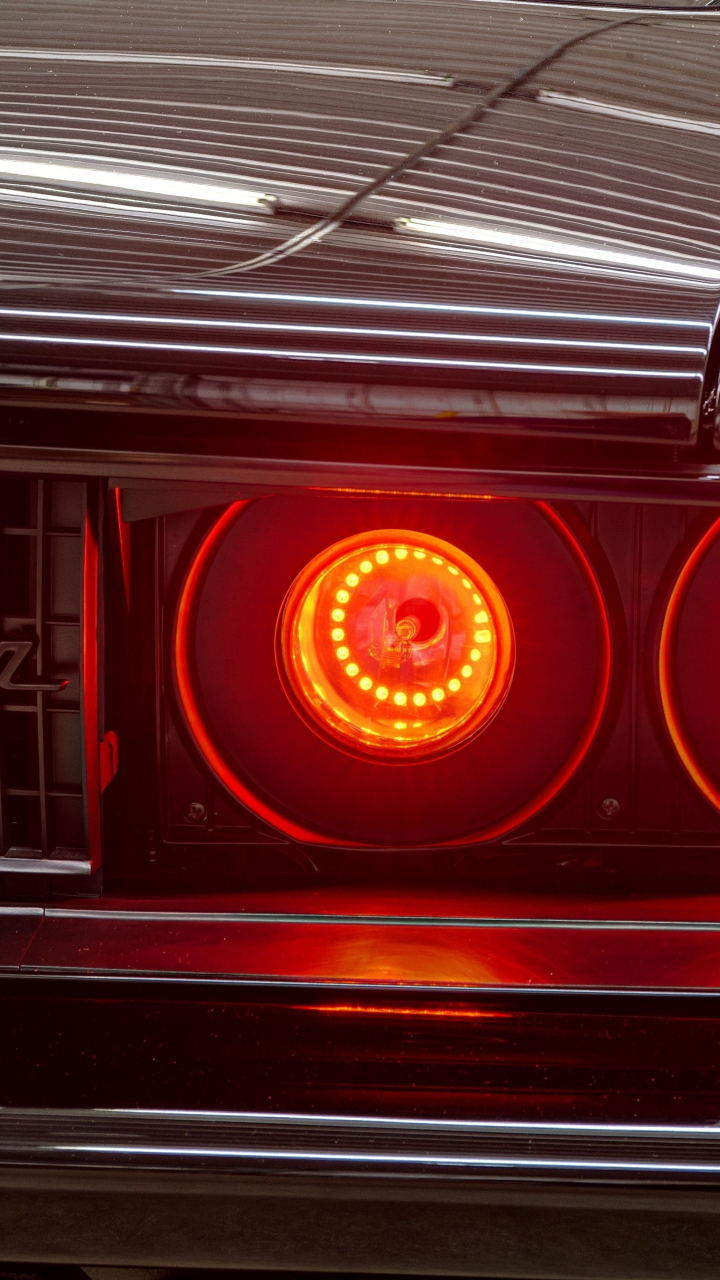 Download dodge charger’s headlight, red glowing 720x1280 wallpaper