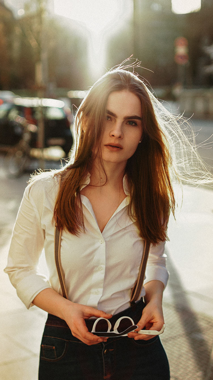 Download wallpaper 720x1280 white shirt, beautiful, street, woman model ...