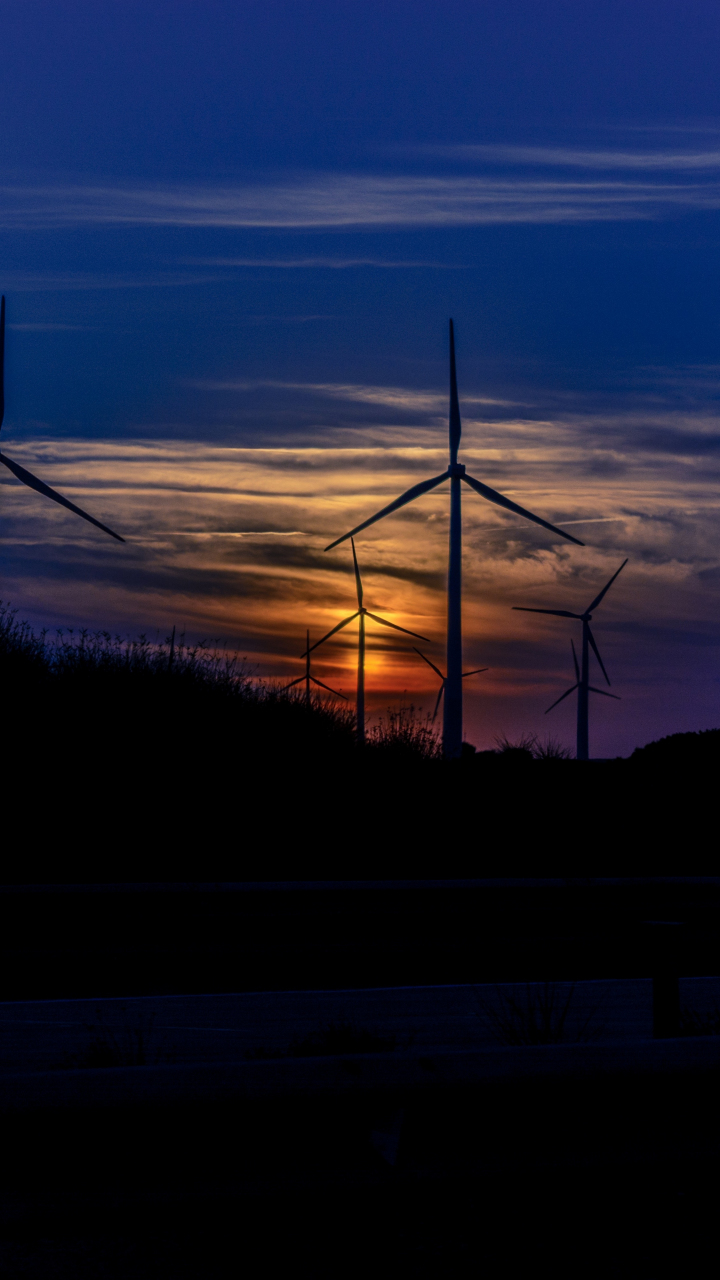 Download wallpaper 720x1280 sunset, wind mills, turbines, blue sky ...