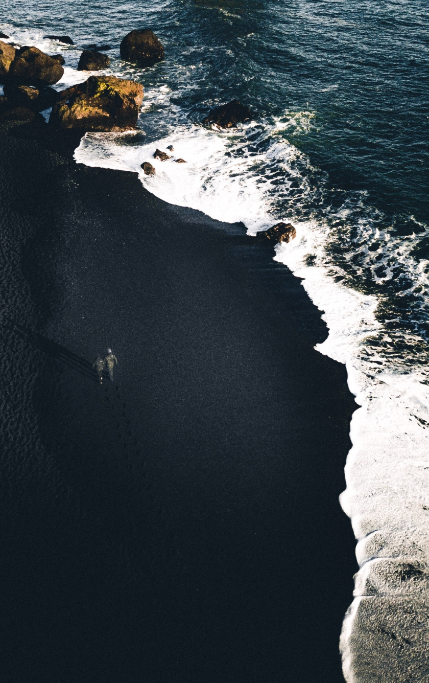 Wallpaper ID 200020  woman in black coat standing on a black sand beach  looking at the ocean in iceland icelandic black sand beach 4k wallpaper  free download