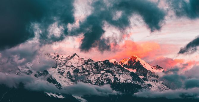 Clouds, sunset, glowing peaks, mountains wallpaper