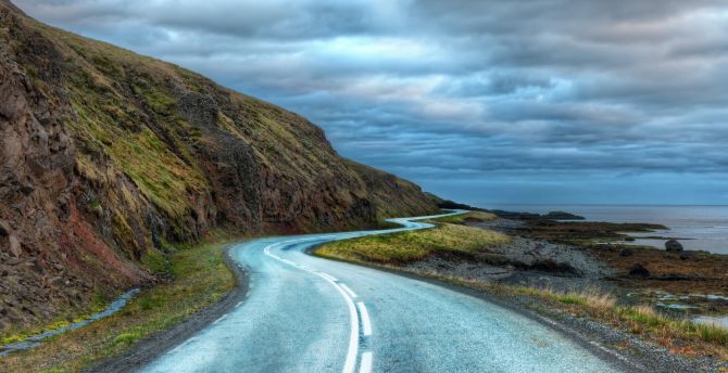Lone road through hills, caostside and cloudy day, nature wallpaper