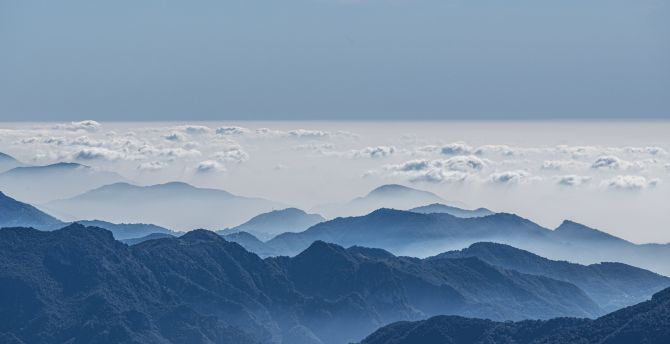 All over clouds, mountains' peak, horizon wallpaper
