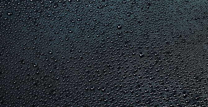 Drops, black surface, close up wallpaper