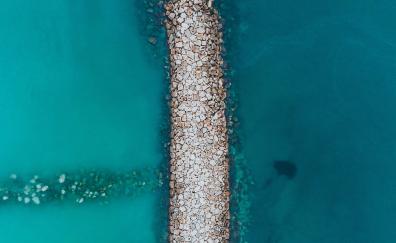 Rock pier, beach, drone view