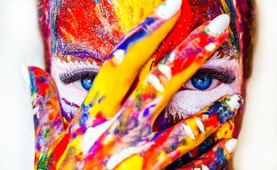 Paint on face and hand, colorful, close up