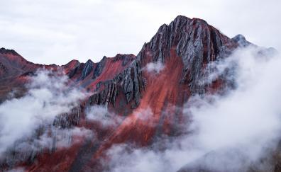 Red mountains, behind the clouds, Cusco, Peru