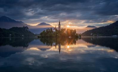 Lake, reflections, church on island, sunset