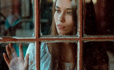 Woman behind the window, girl model