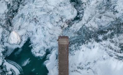 Frozen river, wooden dock, aerial view