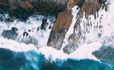 Collide, rocks and sea waves, aerial shot, nature