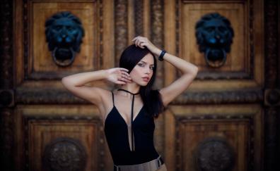 Girl model, black dress, arms up