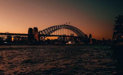 Bridge over bay, city, sunset