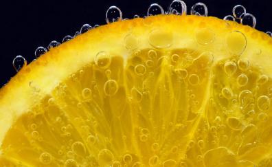 Lemon slice, bubbles, submerged, close up