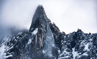 Rocky cliff, fog, mountains