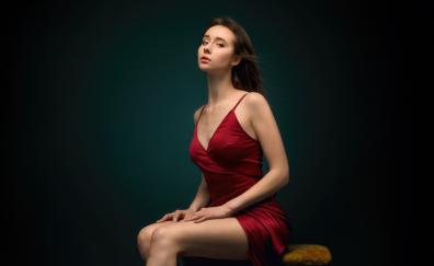 Red dress, beautiful girl sitting on table, pretty look