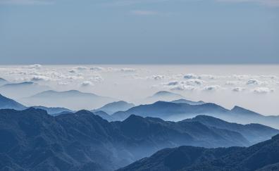 All over clouds, mountains' peak, horizon