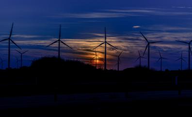 Sunset, wind mills, turbines, blue sky