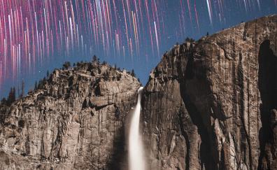 Star trails, rock cliff waterfall