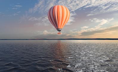 Hot air balloon over lake, body of water, sky