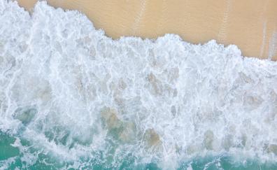 White foams of waves, beach, aerial view