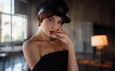 Beautiful woman, bare shoulder, black cap