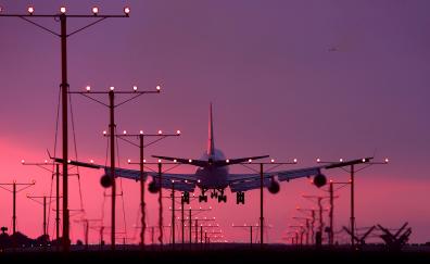 Aircraft, landing, sunset