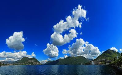 White clouds, blue sky, mountains, sea, nature
